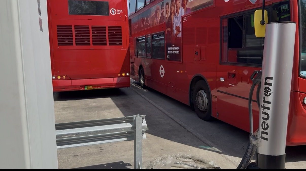 Route 484 electric double-decker bus charging at a Neutron Systems DC fast charger at a London bus depot
